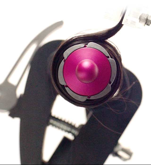 A woman holding the Dyson digital motor V9